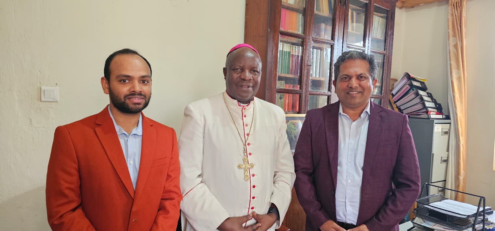 With His Grace Bishop Severus Jjumba